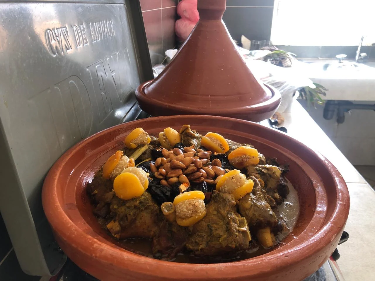 Traditional Berber tagine being prepared in the Atlas Mountains Morocco with local vegetables