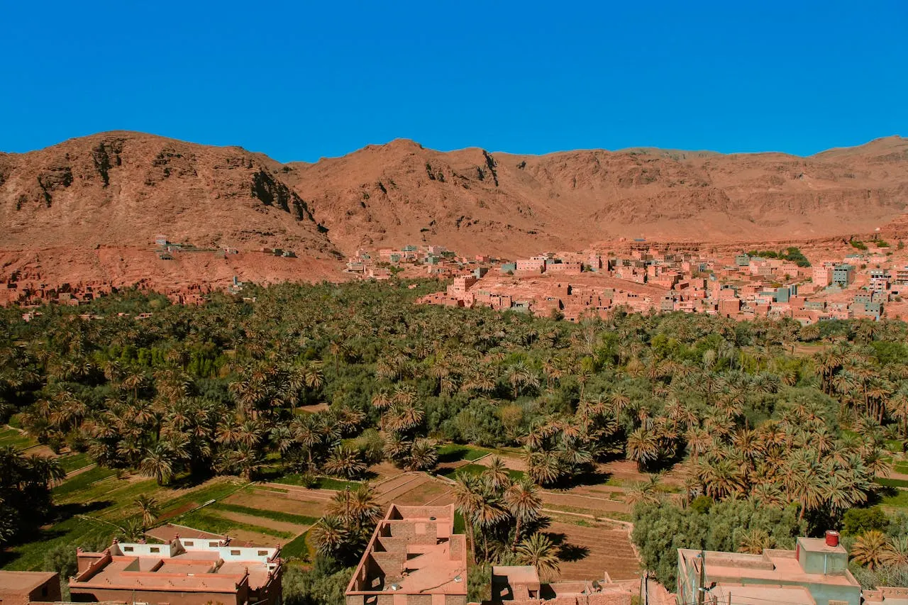Panoramic view of the Atlas Mountains on a day trip from Marrakech, with traditional Berber villages in the valley below