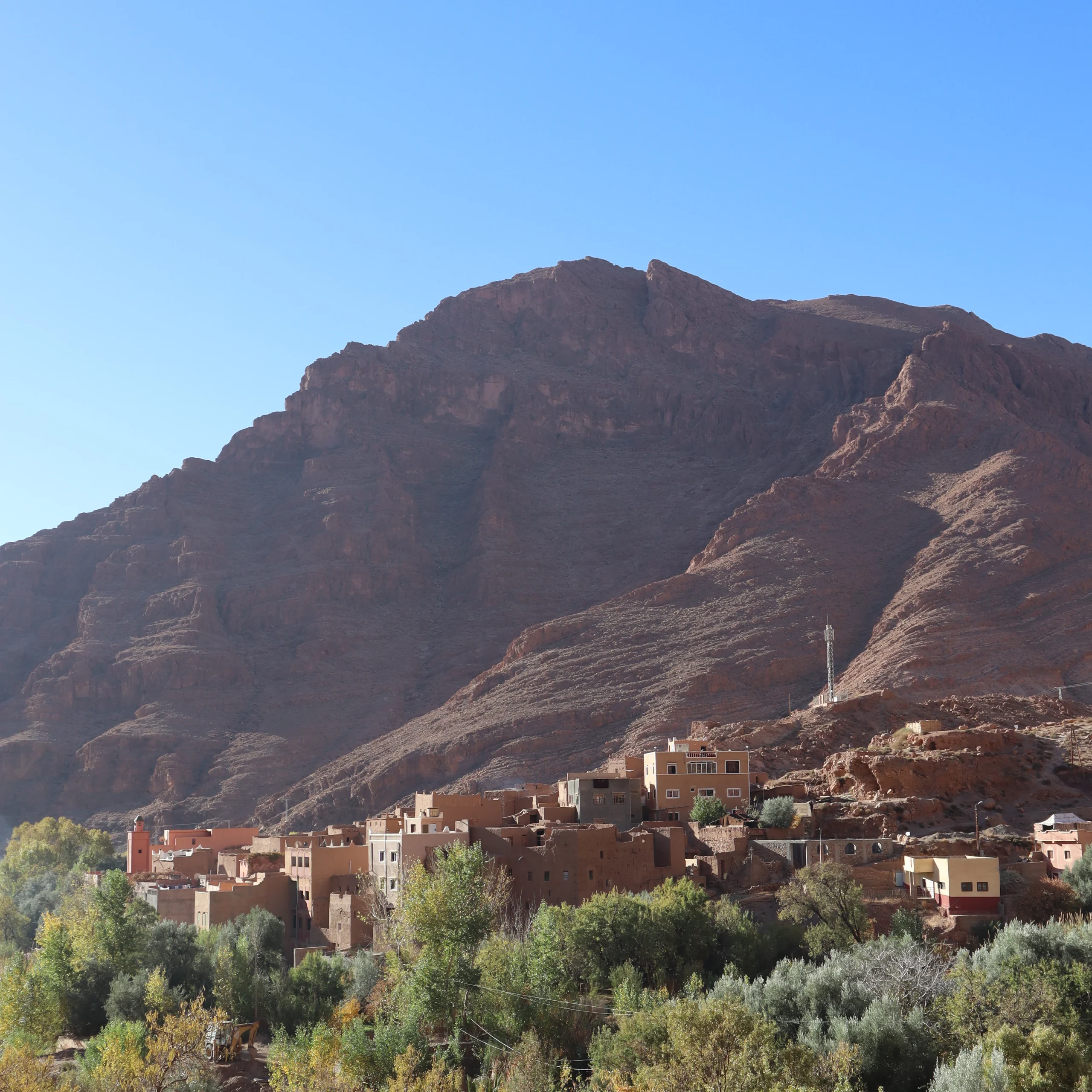 Stunning Atlas Mountains landscape with traditional Berber village nestled among peaks