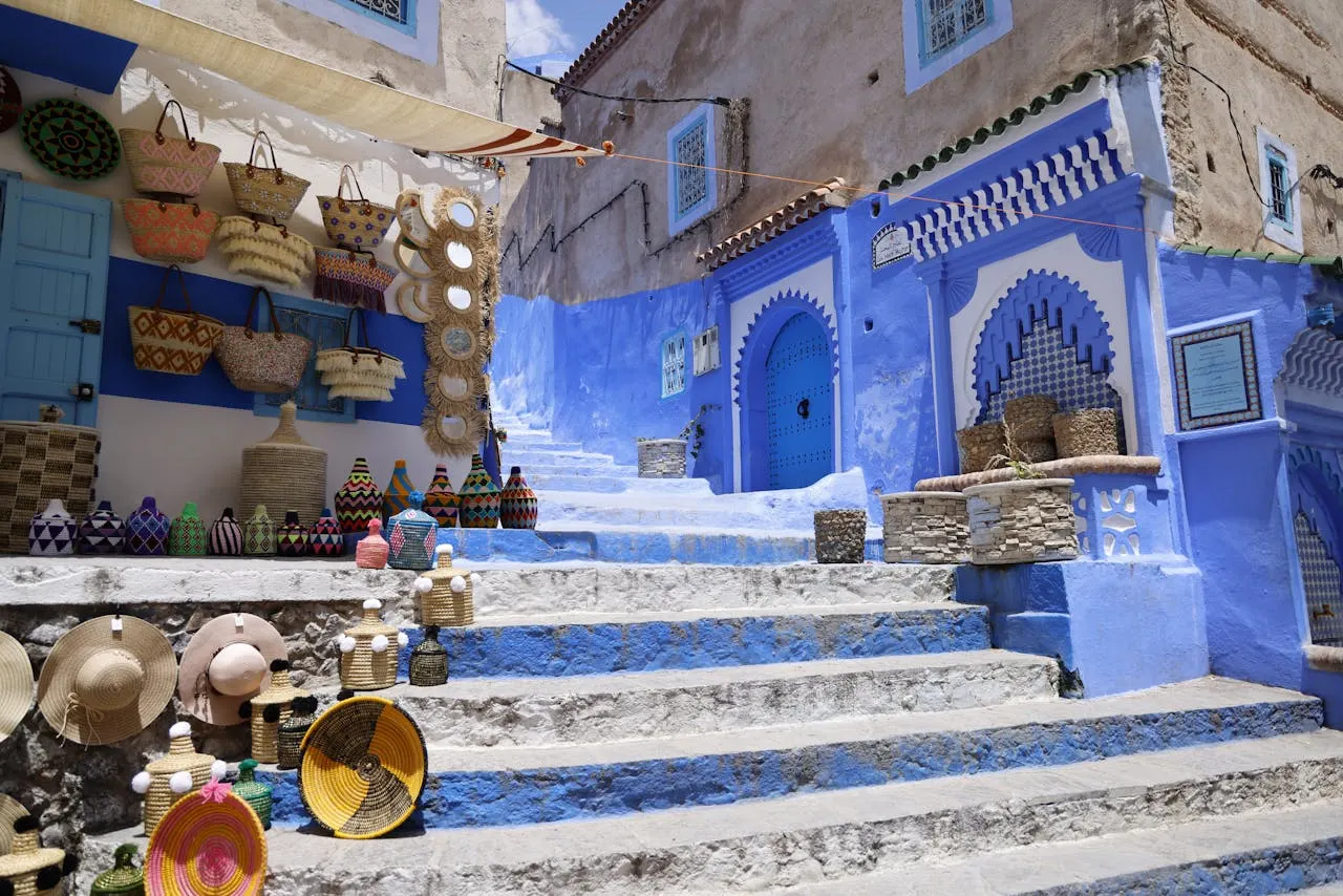 Chefchaouen's alleyways The beauty of blue with a touch of traditional Moroccan pottery